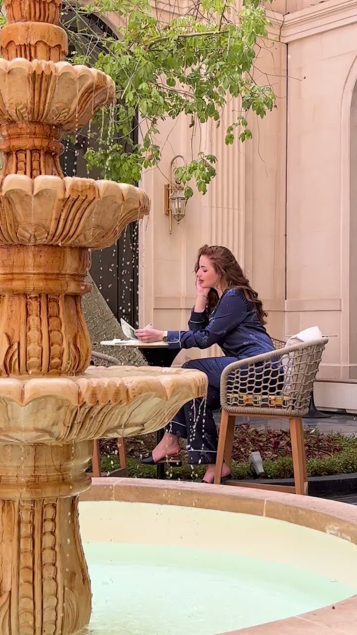The Al Shaheen Nights set, worn reading the paper beside a courtyard fountain
